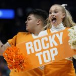 
              Tennessee cheerleaders perform in the first half of an NCAA college basketball semifinal round game between Tennessee and Kentucky at the women's Southeastern Conference tournament Saturday, March 5, 2022, in Nashville, Tenn. (AP Photo/Mark Humphrey)
            