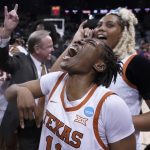 
              Texas guard Joanne Allen-Taylor, center, reacts after Texas beat Ohio State 66-63 in a college basketball game in the Sweet 16 round of the NCAA tournament, Friday, March 25, 2022, in Spokane, Wash. (AP Photo/Ted S. Warren)
            