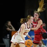 
              Iowa State guard Lexi Donarski (21) drives past Georgia guard Sarah Ashlee Barker (3) during the first half of a second-round game in the NCAA women's college basketball tournament, Sunday, March 20, 2022, in Ames, Iowa. (AP Photo/Charlie Neibergall)
            