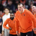 
              Illinois coach Brad Underwood watches during the first half of an NCAA college basketball game against Iowa, Sunday, March 6, 2022, in Champaign, Ill. (AP Photo/Michael Allio)
            