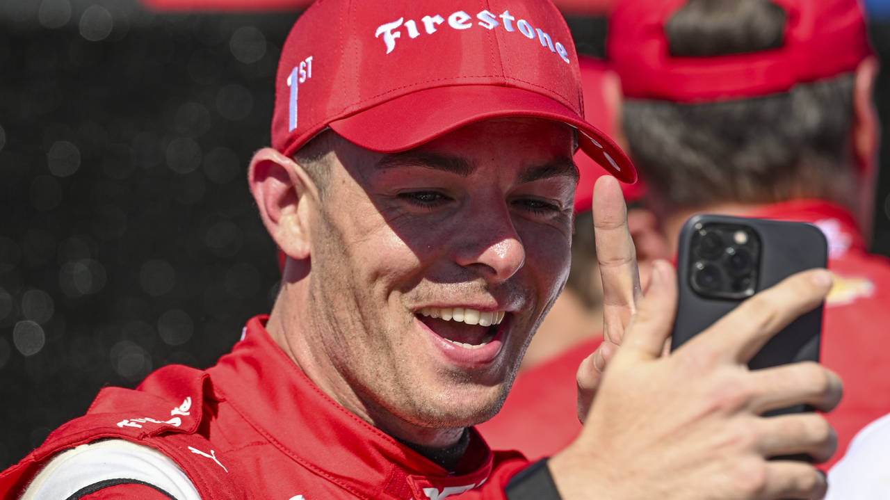 Scott McLaughlin, the driver for Dex Imaging Team Penske (car 3) makes a video call with family bac...