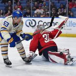 
              Washington Capitals goalie Ilya Samsonov, right, stops a shot by Buffalo Sabres left wing Jeff Skinner during the second period of an NHL hockey game in Buffalo, N.Y., Friday, March 25, 2022. (AP Photo/Adrian Kraus)
            