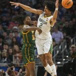 
              Norfolk State forward Kris Bankston (30) passes off again Baylor guard Kendall Brown (2) during the first half of a college basketball game in the first round of the NCAA tournament in Fort Worth, Texas, Thursday, March 17, 2022. (AP Photo/LM Otero)
            