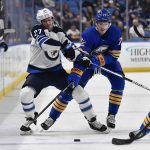 
              Winnipeg Jets left wing Nikolaj Ehlers, left, and Buffalo Sabres right wing Tage Thompson vie for the puck during the first period of an NHL hockey game in Buffalo, N.Y., Wednesday, March 30, 2022. (AP Photo/Adrian Kraus)
            