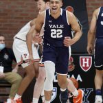 
              Yale forward Matt Knowling (22) reacts after making a basket during the first half of an NCAA Ivy League men's college basketball championship game against Princeton, Sunday, March 13, 2022, in Cambridge, Mass. (AP Photo/Mary Schwalm)
            