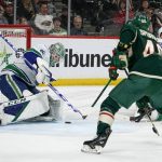 
              Vancouver Canucks goalie Thatcher Demko stops a shot from the Minnesota Wild during the second period of an NHL hockey game Thursday, March 24, 2022, in St. Paul, Minn. (AP Photo/Craig Lassig)
            