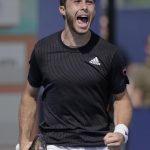 
              Hugo Gaston, of France, reacts after defeating John Isner, of the United States, during the Miami Open tennis tournament, Friday, March 25, 2022, in Miami Gardens, Fla. (AP Photo/Marta Lavandier)
            