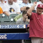 
              Oklahoma baseball coach Skip Johnson yells to the umpires during a Shriners Children's College Classic baseball game against LSU at Minute Maid Park, home of the Houston Astros, Friday, March 4, 2022, in Houston. College baseball might turn out to be an attractive alternative for baseball fans if the Major League Baseball lockout extends deep into the spring. (AP Photo/David J. Phillip)
            