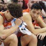 
              Illinois' Benjamin Bosmans-Verdonk, right, and RJ Melendez sit on the bench as their team was losing to Houston with time running out during the second half of a college basketball game in the second round of the NCAA tournament, Sunday, March 20, 2022, in Pittsburgh. Houston won 68-53 to advance to the Sweet 16. (AP Photo/Keith Srakocic)
            