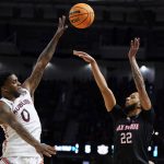 
              Jacksonville State guard Jalen Gibbs shoot over Auburn guard K.D. Johnson during the first half of a college basketball game in the first round of the NCAA tournament on Friday, March 18, 2022, in Greenville, S.C. (AP Photo/Chris Carlson)
            