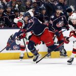 
              New Jersey Devils' Jack Hughes, right, trips Columbus Blue Jackets' Jakub Voracek during the second period of an NHL hockey game Tuesday, March 1, 2022, in Columbus, Ohio. Hughes was penalized on the play. (AP Photo/Jay LaPrete)
            