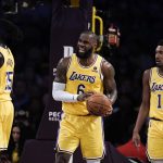 
              Los Angeles Lakers' LeBron James, center, reacts to a foul call against him during first half of an NBA basketball game against the Toronto Raptors, Monday, March 14, 2022, in Los Angeles. (AP Photo/Jae C. Hong)
            