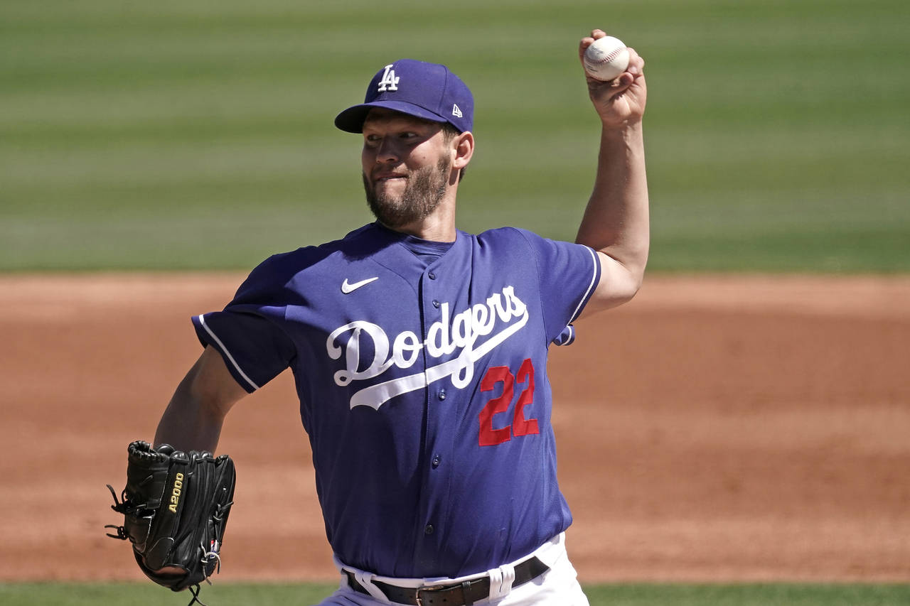 Los Angeles Dodgers starting pitcher Clayton Kershaw throws during the first inning of a spring tra...