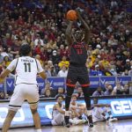 
              San Diego State forward Aguek Arop (33) shoots as Colorado State forward Dischon Thomas (11) watches during the first half of an NCAA college basketball game in the semifinals of Mountain West Conference men's tournament Friday, March 11, 2022, in Las Vegas. (AP Photo/Rick Bowmer)
            