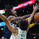 
              Memphis Grizzlies guard Ja Morant drives to the basket against Boston Celtics guard Derrick White during the first half of an NBA basketball game, Thursday, March 3, 2022 in Boston. (AP Photo/Charles Krupa)
            