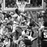 
              FILE - Georgetown's Patrick Ewing (33) blocks a shot by Villanova's Harold Pressley (21) during the NCAA men's college basketball tournament championship game in Lexington, Ky., April 1, 1985. After beating St. John's in the semis, Georgetown went up against another Big East rival, but fell short in its bid for a second straight title. (AP Photo/Bob Jordan, File)
            
