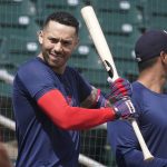 
              Minnesota Twins' Carlos Correa stretches as he gets ready for baseball batting practice at Hammond Stadium Wednesday, March 23, 2022, in Fort Myers, Fla.  (AP Photo/Steve Helber)
            