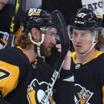 
              Pittsburgh Penguins' Jeff Carter (77) talks with newly acquired Rickard Rakell (67) during the first period of the team's NHL hockey game against the Columbus Blue Jackets in Pittsburgh, Tuesday, March 22, 2022. (AP Photo/Gene J. Puskar)
            