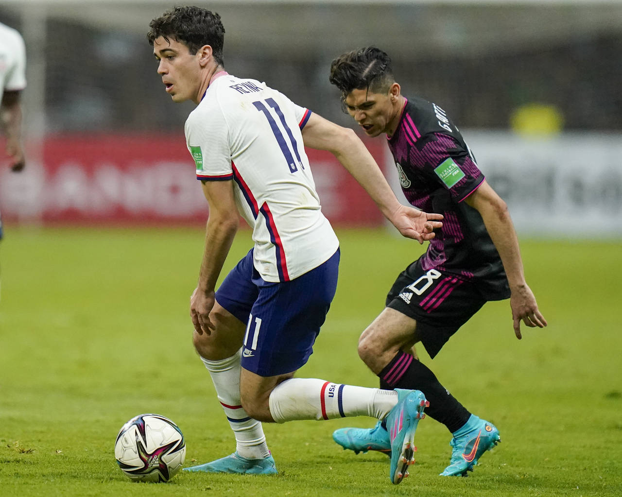 United States' Giovanni Reyna, left, dribbles the ball chased by Mexico's Gerardo Arteaga during a ...