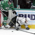 
              Los Angeles Kings center Phillip Danault (24) falls to the ice against Dallas Stars defenseman Ryan Suter (20) during the second period of an NHL hockey game in Dallas, Wednesday, March 2, 2022. (AP Photo/LM Otero)
            