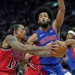 
              Chicago Bulls forward DeMar DeRozan (11) drives as Detroit Pistons forward Marvin Bagley III defends during the second half of an NBA basketball game, Wednesday, March 9, 2022, in Detroit. (AP Photo/Carlos Osorio)
            