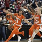 
              Miami forward Destiny Harden (3), forward Naomi Mbandu (35) and guard Karla Erjavec (25) react after defeating Louisville in an NCAA college basketball quarterfinal game at the Atlantic Coast Conference women's tournament in Greensboro, N.C., Friday, March 4, 2022. (AP Photo/Gerry Broome)
            