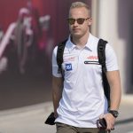 
              FILE - Haas driver Nikita Mazepin of Russia arrives to the Losail International Circuit in Losail, Qatar, Thursday, Nov. 18, 2021 ahead of the Qatar Formula One Grand Prix. Auto racing's international body, the FIA, said Russian drivers like Nikita Mazepin can still compete but a block on having cars in national colors would stop Mazepin's team Haas bringing back the Russian flag-stripe livery it removed during last week's testing. The Russian Grand Prix was cut from the calendar on Friday. (AP Photo/Darko Bandic, File)
            