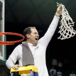 
              Baylor head coach Scott Drew holds up the game net after an NCAA college basketball game against Iowa State in Waco, Texas, Saturday, March 5, 2022. Baylor won 75-68 and is Big 12 regular season co-champion with Kansas. (AP Photo/LM Otero)
            