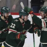 
              Minnesota Wild left wing Kevin Fiala (22) celebrates with left wing Kirill Kaprizov (97) after Fiala scored a goal during overtime to win the game during an NHL hockey game Sunday, March 27, 2022, in St. Paul, Minn. (AP Photo/Stacy Bengs)
            
