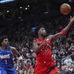 
              Toronto Raptors forward OG Anunoby (3) drives past Minnesota Timberwolves forward Anthony Edwards (1) during the first half of an NBA basketball game Wednesday, March 30, 2022, in Toronto. (Nathan Denette/The Canadian Press via AP)
            