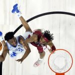 
              Duke guard Jeremy Roach, left, drives to the basket as Arkansas guard JD Notae defends during the second half of a basketball game in the Elite 8 round of the NCAA men's tournament Saturday, March 26, 2022, in San Francisco. (AP Photo/Marcio Jose Sanchez)
            