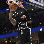 
              Brooklyn Nets center Andre Drummond dunks against the Memphis Grizzlies during the first half of an NBA basketball game Wednesday, March 23, 2022, in Memphis, Tenn. (AP Photo/Brandon Dill)
            