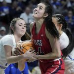 
              Gonzaga's Abby O'Connor (4) battles for the ball with BYU's Shaylee Gonzales, left, during the first half of an NCAA women's championship college basketball game at the West Coast Conference tournament Tuesday, March 8, 2022, in Las Vegas. (AP Photo/John Locher)
            