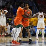 
              Miami guard Bensley Joseph, left, and guard Charlie Moore celebrate after their winning against Southern California during a college basketball game in the first round of the NCAA tournament on Friday, March 18, 2022, in Greenville, S.C. (AP Photo/Chris Carlson)
            