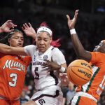 
              South Carolina forward Victaria Saxton (5) battles for the ball against Miami forward Destiny Harden (3) and guard Ja'Leah Williams (12) during the first half a second-round game in the NCAA college basketball tournament Sunday, March 20, 2022 in Columbia, S.C. (AP Photo/Sean Rayford)
            