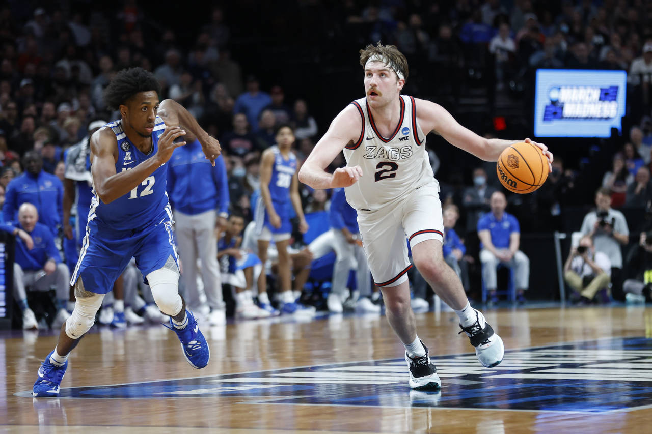 Gonzaga forward Drew Timme (2) drives past Memphis forward DeAndre Williams (12) during the second ...