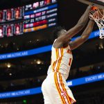 
              Atlanta Hawks center Clint Capela (15) scores during the first half of an NBA basketball game against the Cleveland Cavaliers, Thursday, March 31, 2022, in Atlanta. (AP Photo/Hakim Wright Sr.)
            