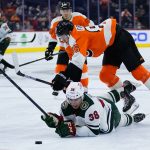 
              Philadelphia Flyers' Joel Farabee (86) and Minnesota Wild's Ryan Hartman (38) collide during the third period of an NHL hockey game, Thursday, March 3, 2022, in Philadelphia. (AP Photo/Matt Slocum)
            