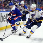 
              St. Louis Blues' Colton Parayko (55) fights for control of the puck with New York Islanders' Adam Pelech (3) during the second period of an NHL hockey game Saturday, March 5, 2022, in Elmont, N.Y. (AP Photo/Frank Franklin II)
            