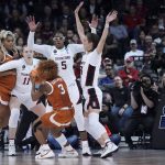 
              Stanford forward Francesca Belibi (5) and other players defend as Texas guard Rori Harmon (3) looks to shoot during the second half of a college basketball game in the Elite 8 round of the NCAA tournament, Sunday, March 27, 2022, in Spokane, Wash. (AP Photo/Ted S. Warren)
            
