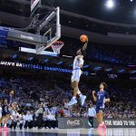 
              North Carolina's Caleb Love goes for a dunk during the second half of a college basketball game against St. Peter's in the Elite 8 round of the NCAA tournament, Sunday, March 27, 2022, in Philadelphia. (AP Photo/Matt Rourke)
            