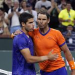 
              Rafael Nadal, of Spain, right, greets Carlos Alcaraz, of Spain, after defeating him in the men's singles semifinals at the BNP Paribas Open tennis tournament Saturday, March 19, 2022, in Indian Wells, Calif. Nadal won 6-4, 4-6, 6-3. (AP Photo/Mark J. Terrill)
            