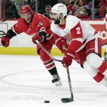 
              FILE - Detroit Red Wings defenseman Nick Leddy (2) moves the puck as Carolina Hurricanes right wing Stefan Noesen (29) skates in during an NHL hockey game on Dec. 16, 2021, in Raleigh, N.C. The Blues traded away another member of the 2019 Cup team in Oskar Sundqvist to upgrade on defense with Nick Leddy. (AP Photo/Chris Seward, File)
            
