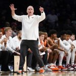 
              Virginia Tech head coach Mike Young works the bench in the first half of an NCAA college basketball game against North Carolina during semifinals of the Atlantic Coast Conference men's tournament, Friday, March 11, 2022, in New York. (AP Photo/John Minchillo)
            