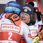 
              United States' Mikaela Shiffrin, back to camera, and France's Tessa Worley hug each other at the end of an alpine ski, women's World Cup giant slalom, in Lenzerheide, Switzerland, Sunday, March 6, 2022. Worley won the race. (AP Photo/Giovanni Auletta)
            