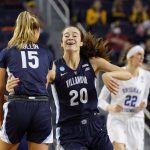 
              Villanova forward Maddy Siegrist (20) celebrates her 3-point basket with guard Brooke Mullin (15) during the second half of a college basketball game in the first round of the NCAA tournament against BYU, Saturday, March 19, 2022, in Ann Arbor, Mich. (AP Photo/Carlos Osorio)
            