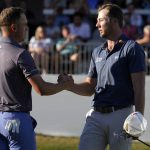 
              Sam Burns, right, shakes hands with Justin Thomas after finishing their round during the final round of the Valspar Championship golf tournament Sunday, March 20, 2022, at Innisbrook in Palm Harbor, Fla. Burns won the tournament in a playoff. (AP Photo/Chris O'Meara)
            