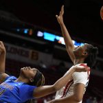 
              DePaul forward Aneesah Morrow (24) fights for a rebound with Dayton center Tenin Magassa, right, during the first half of a First Four game in the NCAA women's college basketball tournament, Wednesday, March 16, 2022, in Ames, Iowa. (AP Photo/Charlie Neibergall)
            