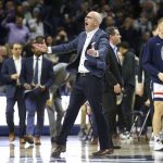 
              Connecticut head coach Dan Hurley gestures to the crowd during the first half of an NCAA college basketball game against DePaul Saturday, March 5, 2022, in Storrs, Conn. (AP Photo/Stew Milne)
            