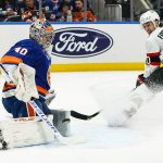 
              New York Islanders goaltender Semyon Varlamov (40) stops a shot by Ottawa Senators' Alex Formenton (10) during the first period of an NHL hockey game Tuesday, March 22, 2022, in Elmont, N.Y. (AP Photo/Frank Franklin II)
            